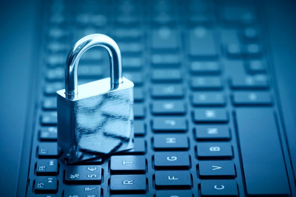 Padlock on computer keyboard — Locksmith in Carrara, QLD