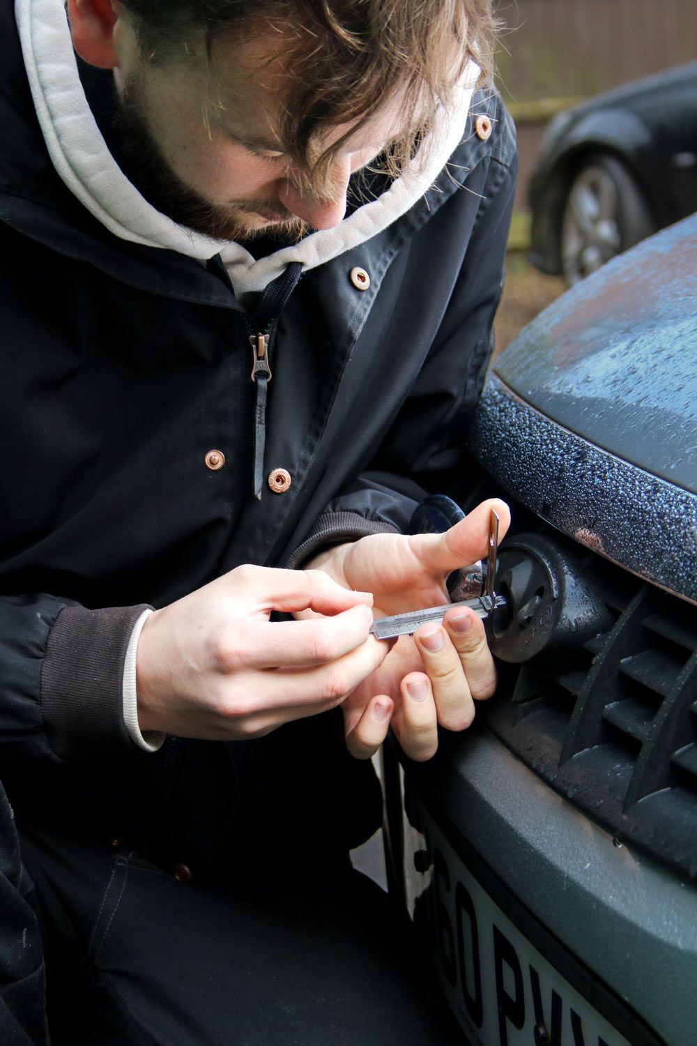 Man opening car with key — Locksmith in Robina, QLD