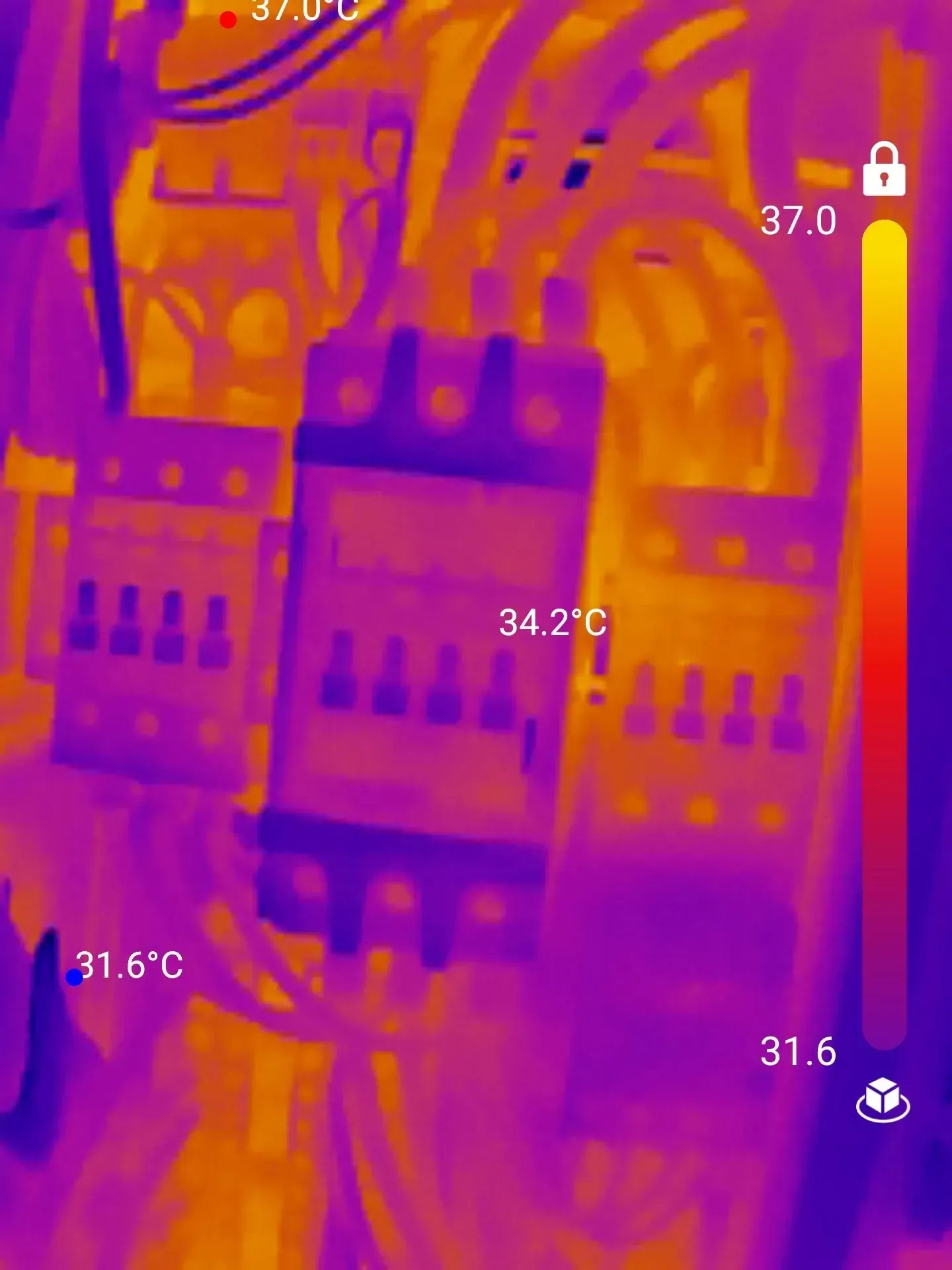 Thermal image of electrical components, with temperature readings ranging from 31.6°C to 37.0°C.