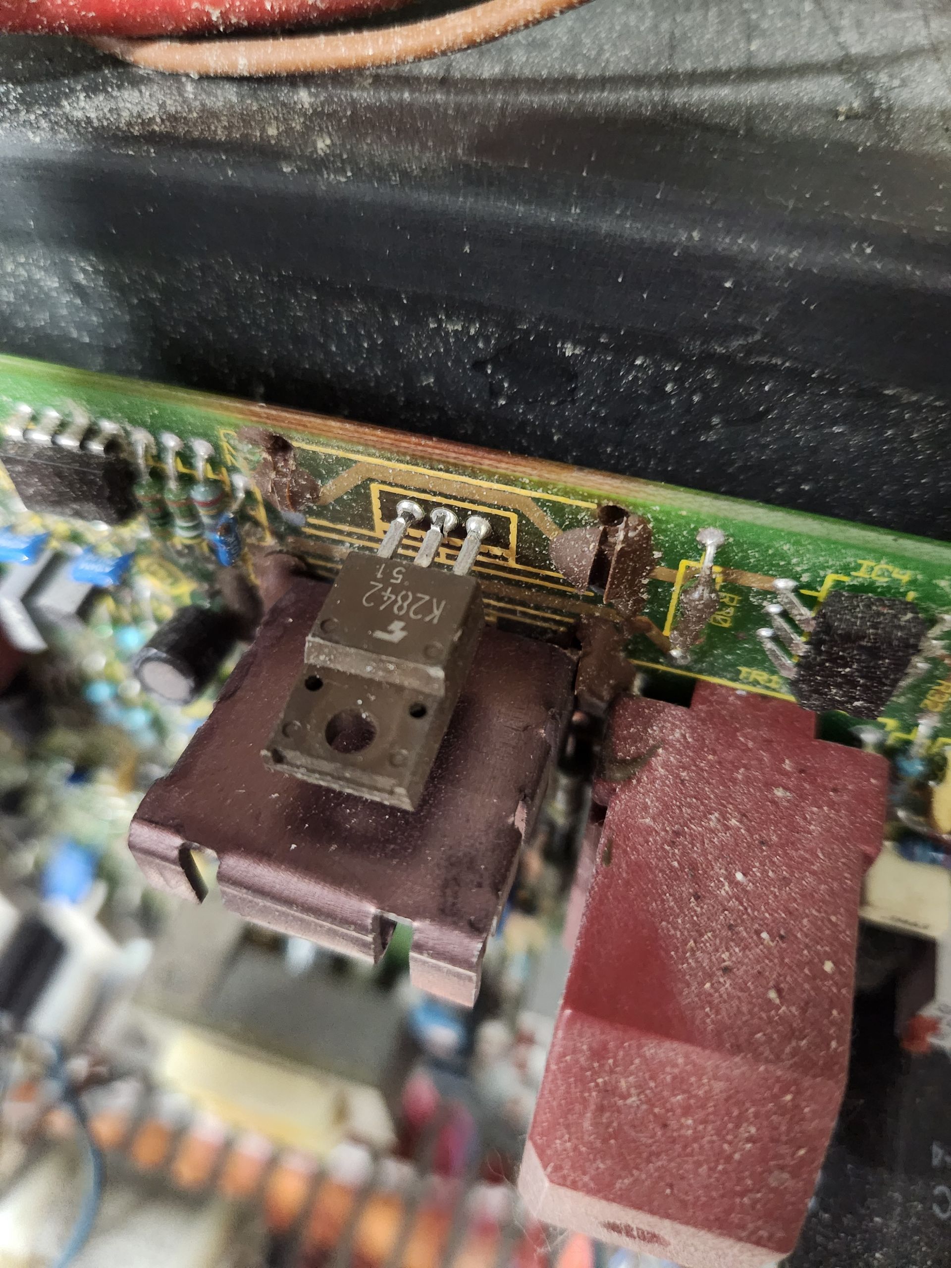Circuit board with a transistor mounted on a metal plate, connected to wiring.