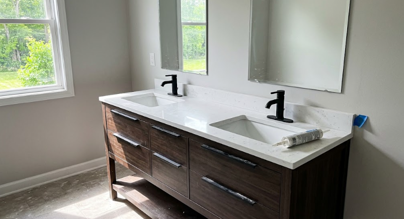 A beautifully completed luxury bathroom remodel in Spokane, WA, featuring a custom double vanity and walk-in shower.