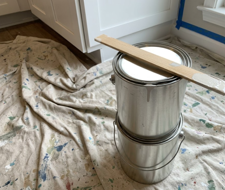 Premium interior painting supplies and clean drop cloths ready for a residential project.