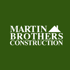 Martin Brothers Construction logo in white on a dark green background with a roof icon