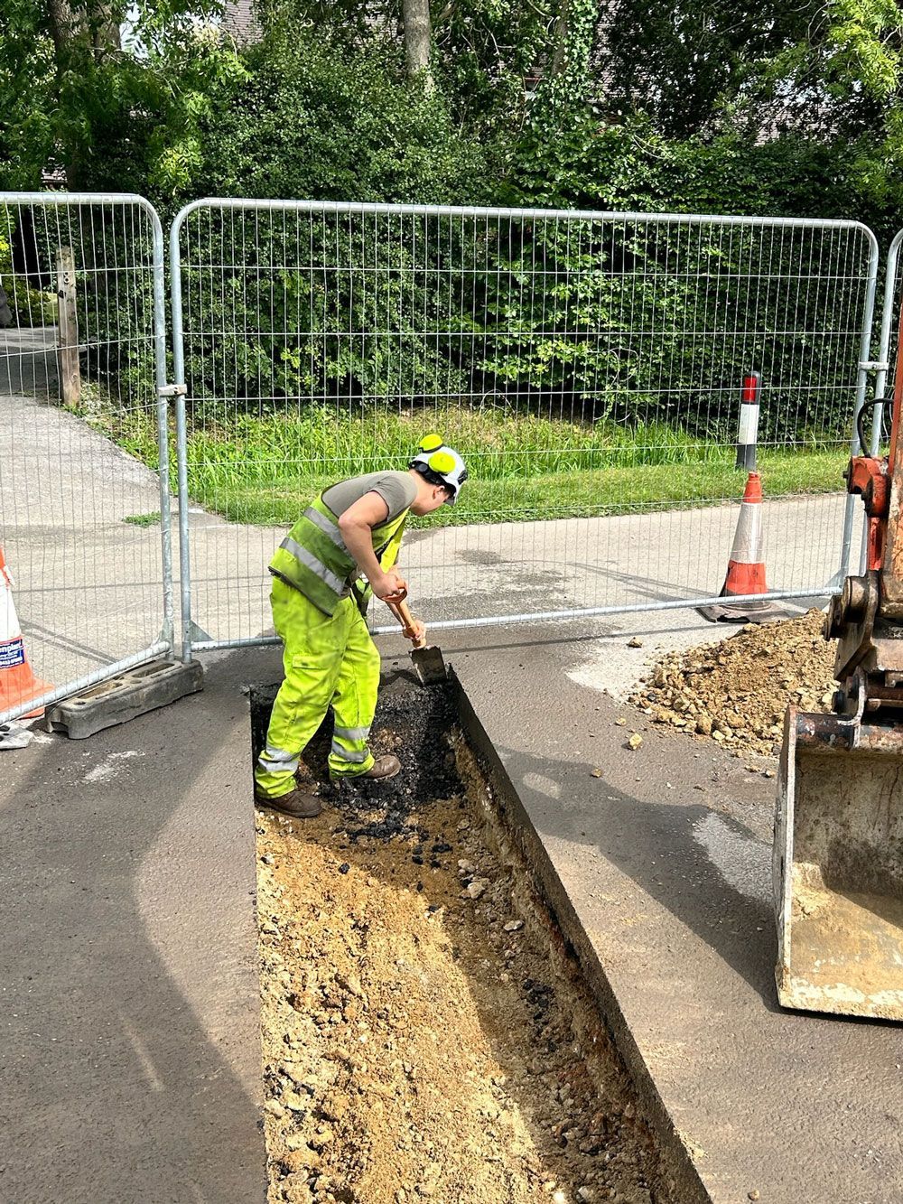Groundworker working in road