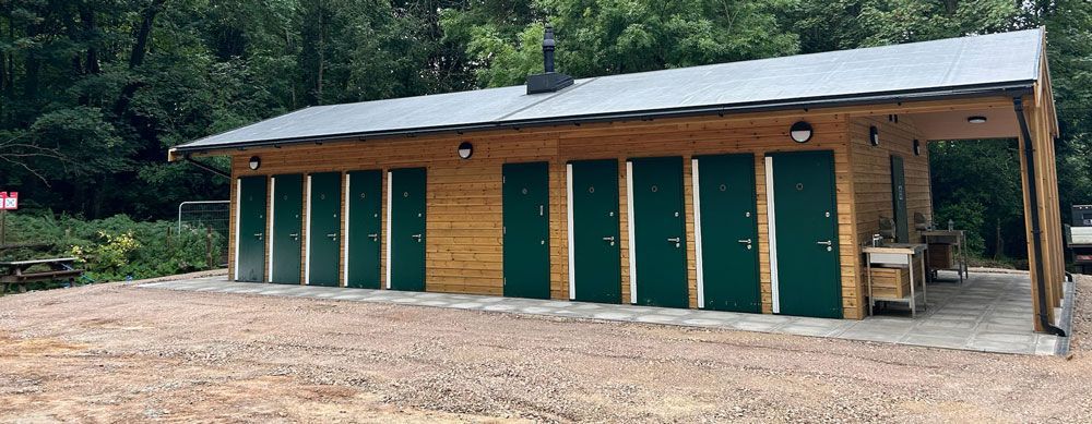 Completed toilet block building on concrete slab, with drainage and  paving works, at Youlbury