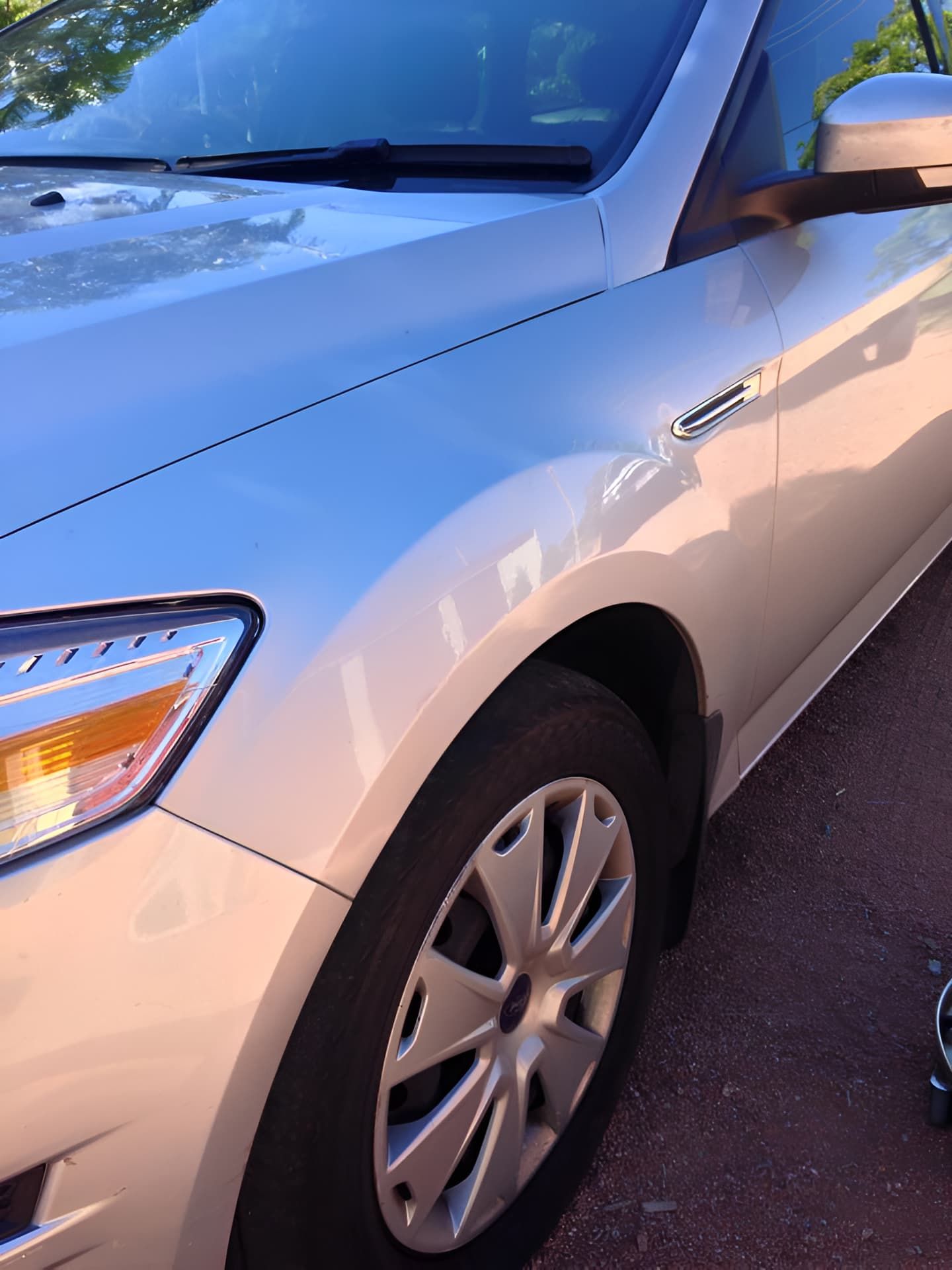 A Silver Car is Parked on the Side of the Road — Dek-A-Dent Townsville In Wulguru, QLD