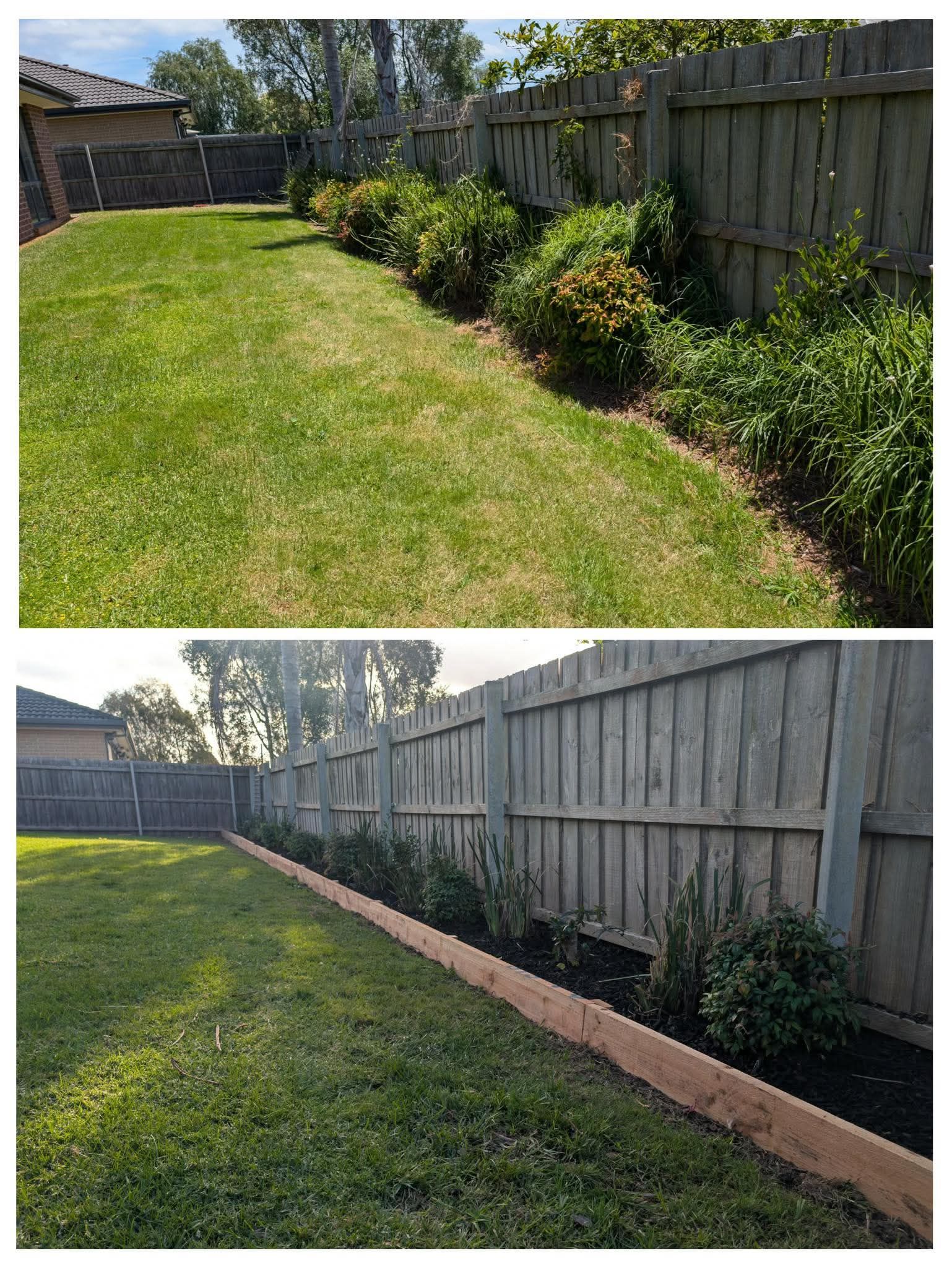 Backyard fence with freshly edged lawn and new garden border along the right side