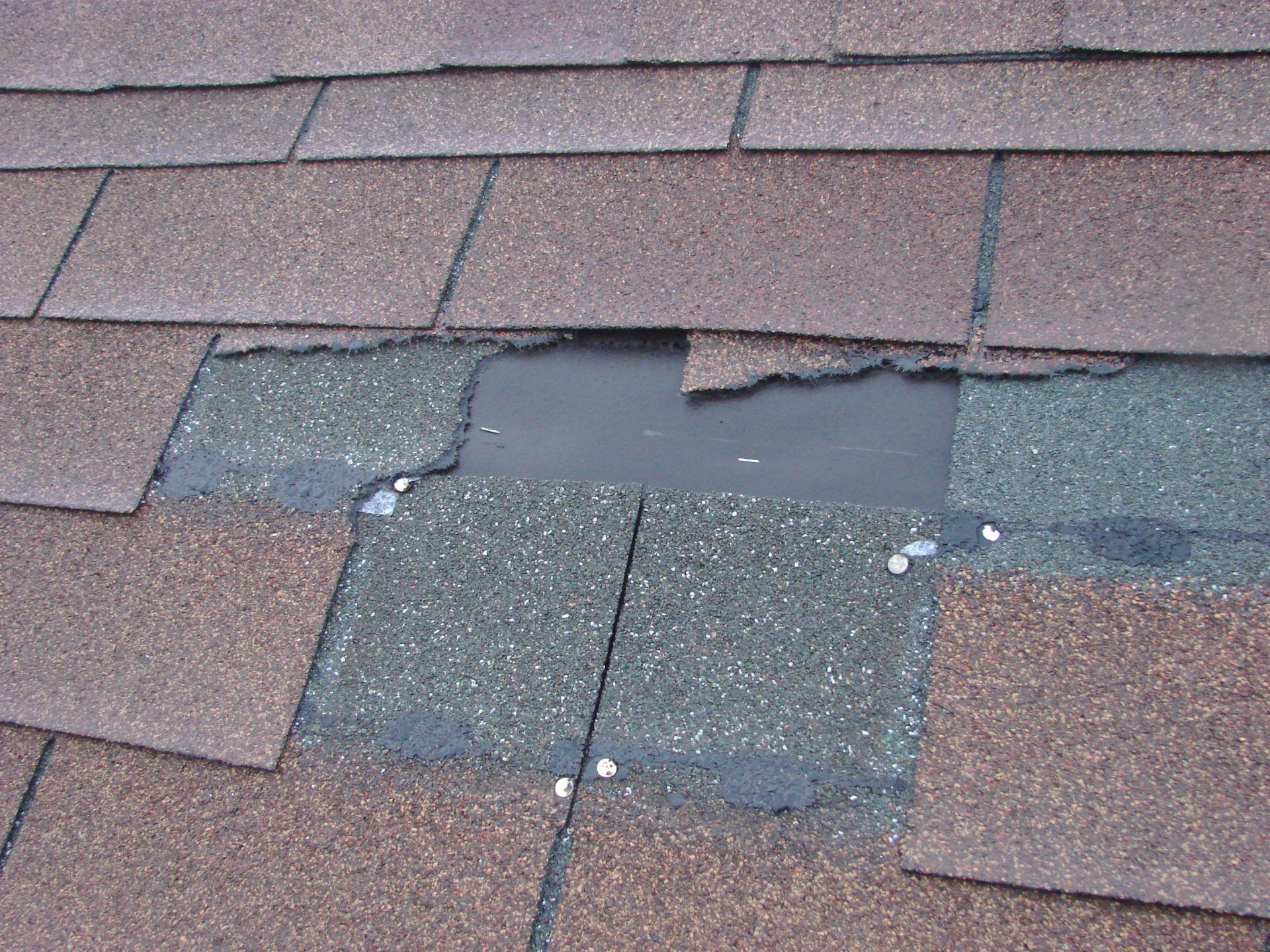 A close up of a roof with a hole in it