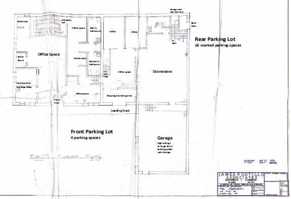 Floor plan showing office spaces, a front and rear parking lot, and a storage area.