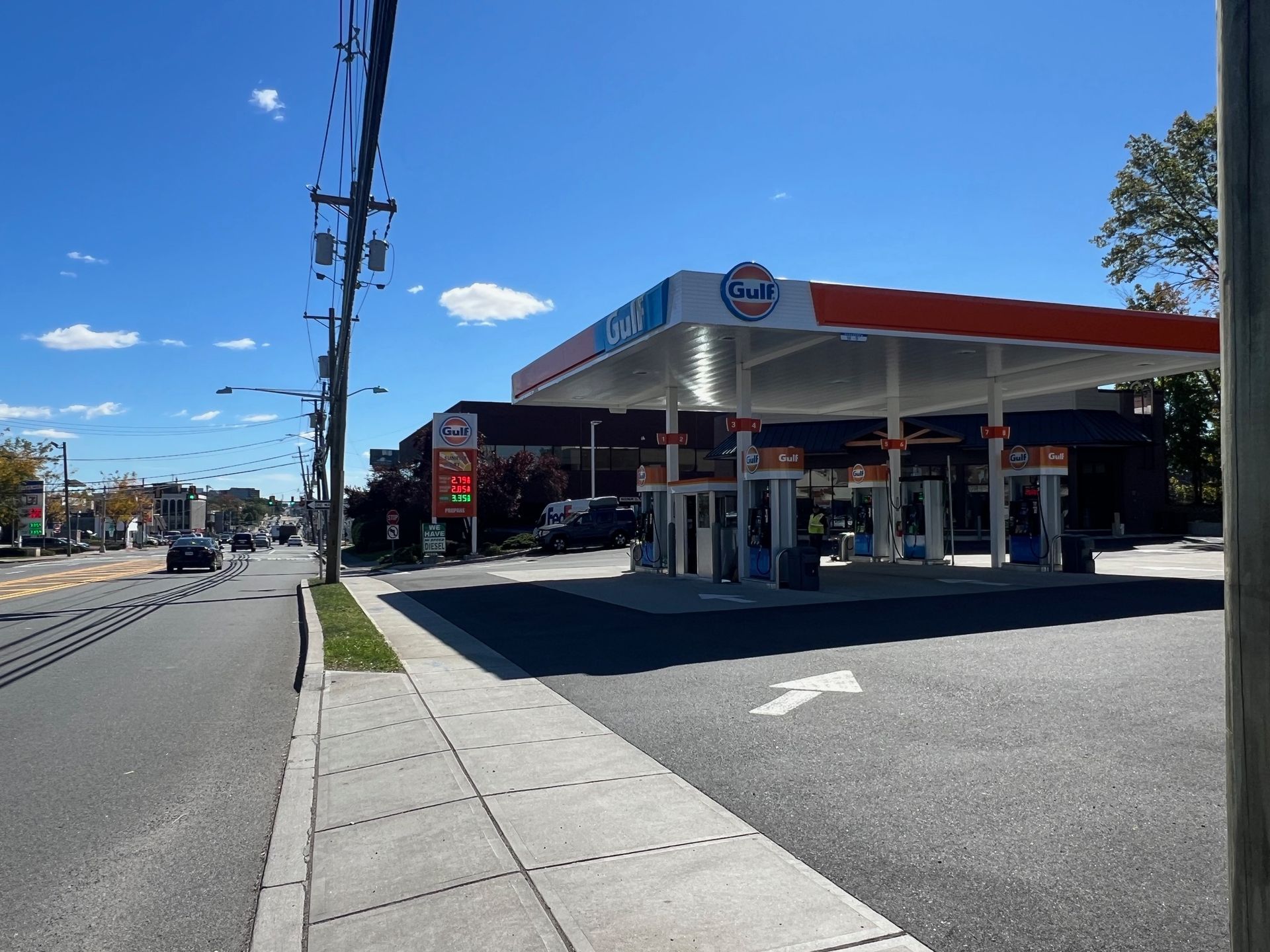 A gas station with an arrow pointing to the right