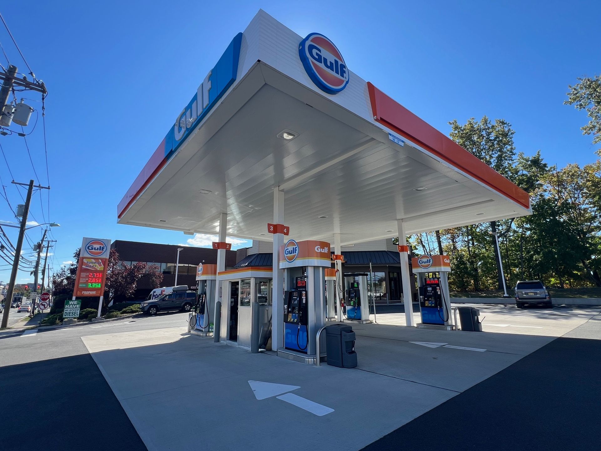 A gas station with an arrow pointing to the right.