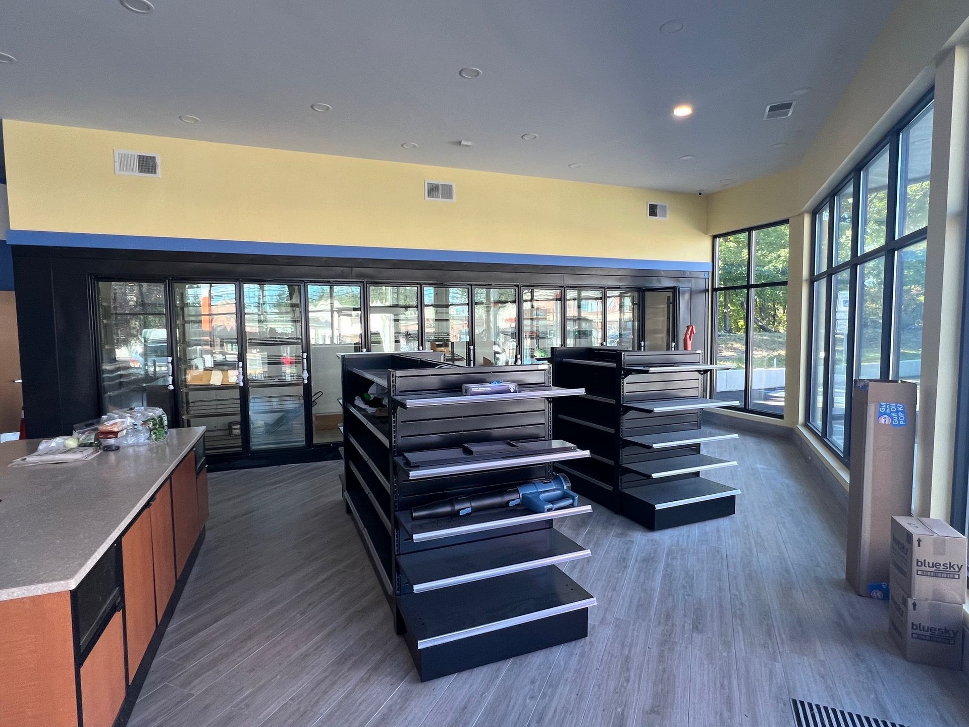 A store with a lot of shelves and a lot of windows.