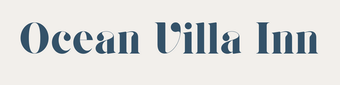 Ocean Villa Inn logo in a muted blue font on an off-white background.
