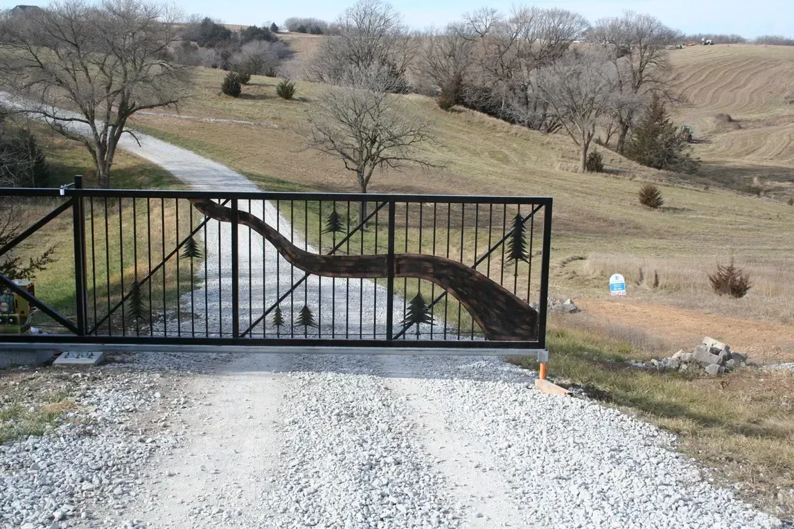 a large white house with a black gate in front of it