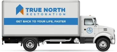 White truck with the True North Restoration logo on the side.