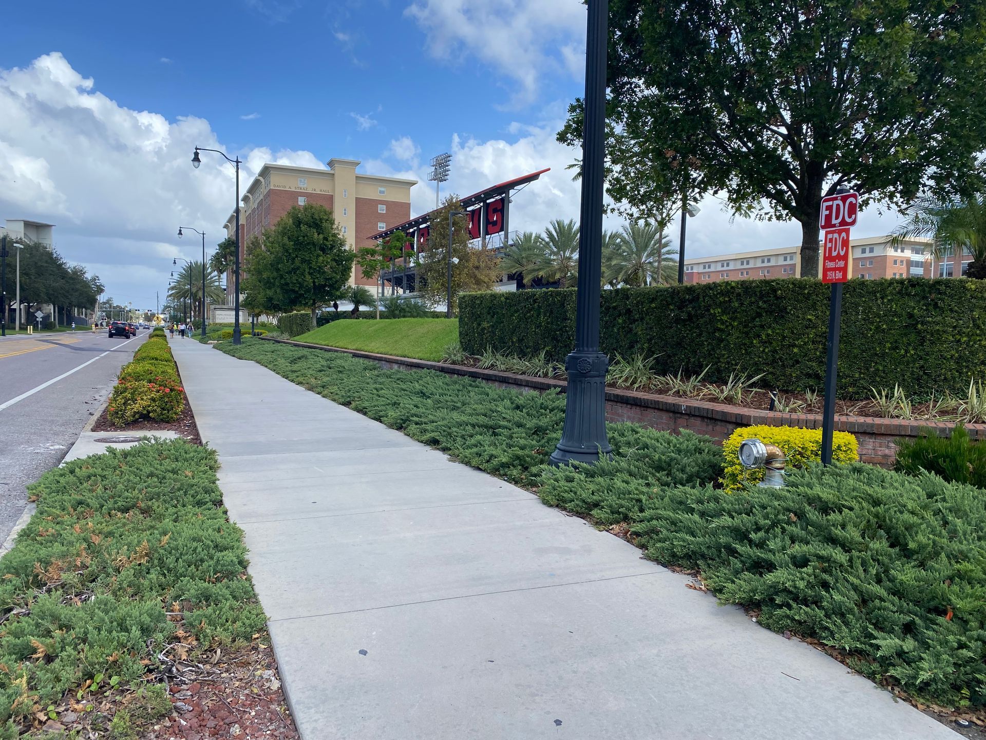 A sidewalk with a sign that says no parking on it