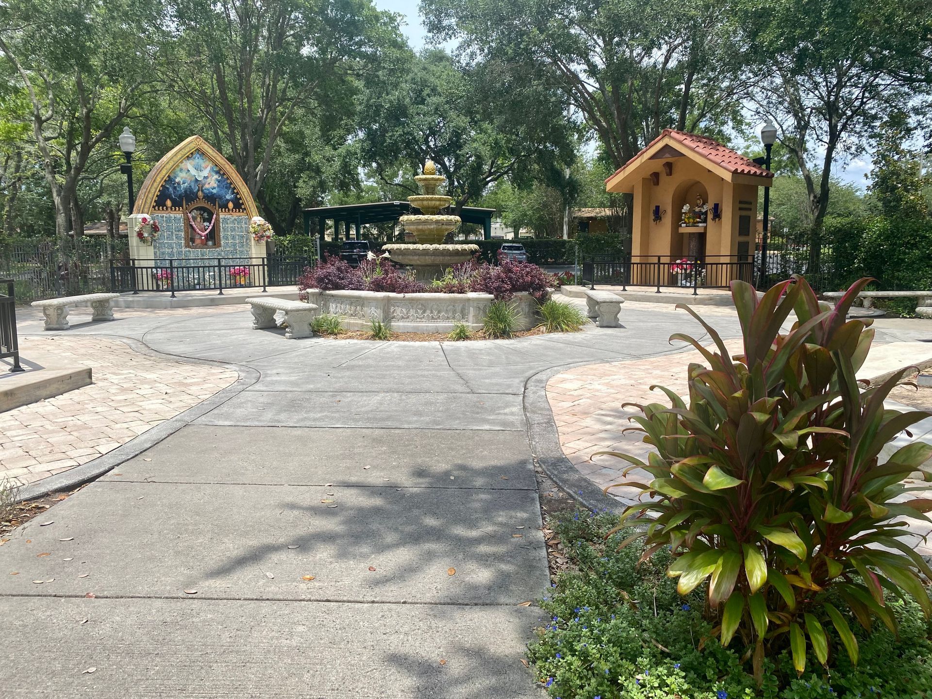 There is a fountain in the middle of the park.