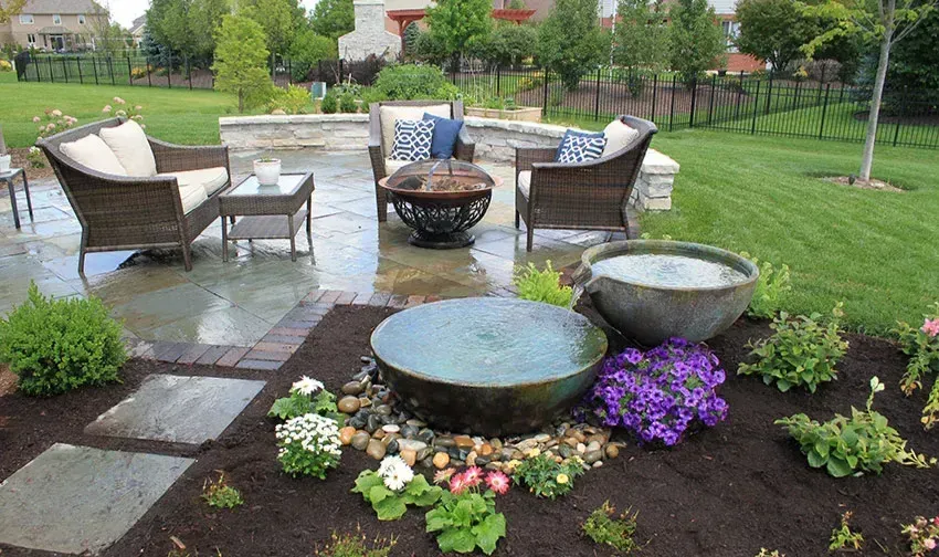 There is a fountain in the middle of the garden- Crowders Landscaping