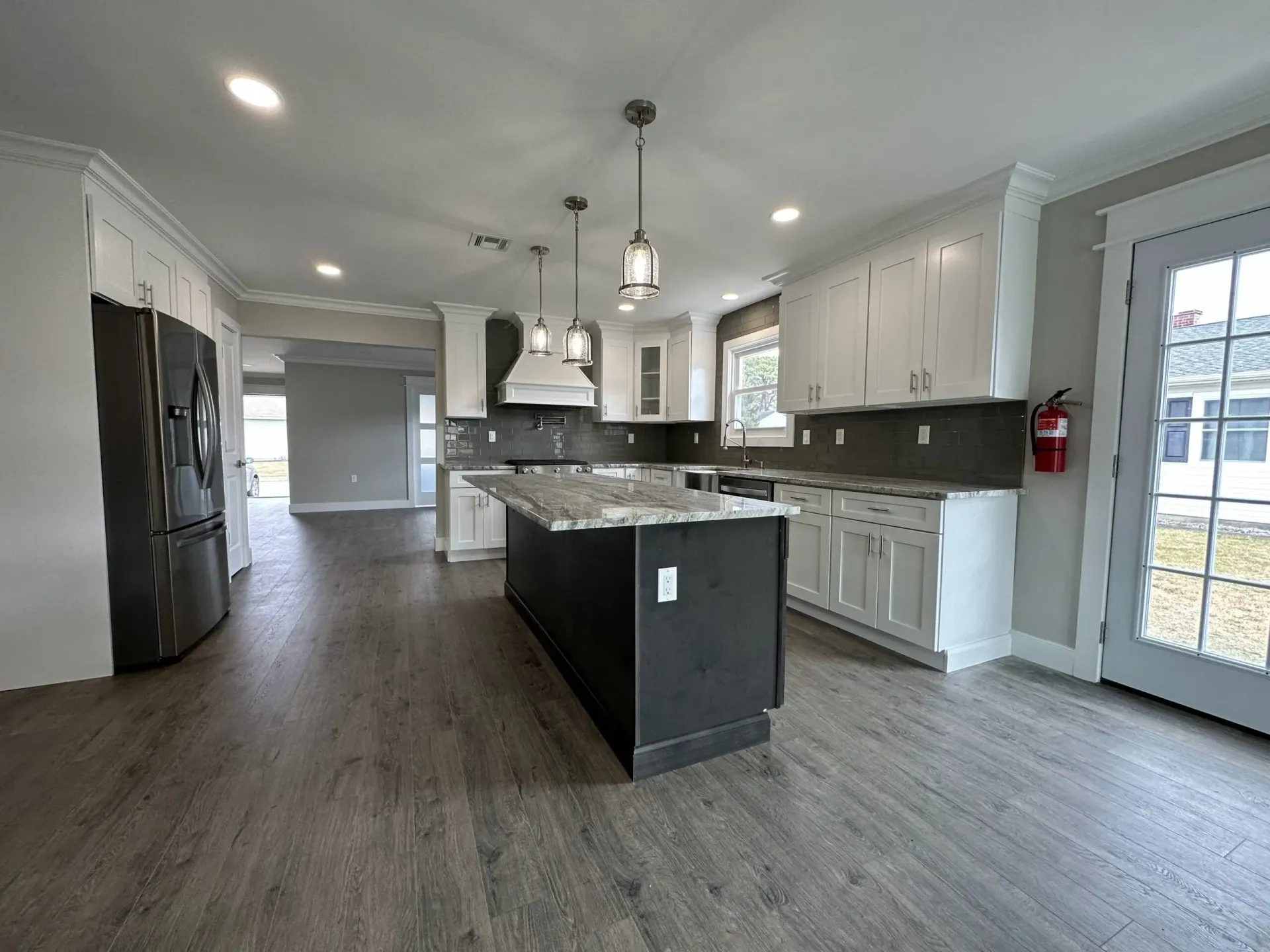 A kitchen with a large island in the middle of the room.