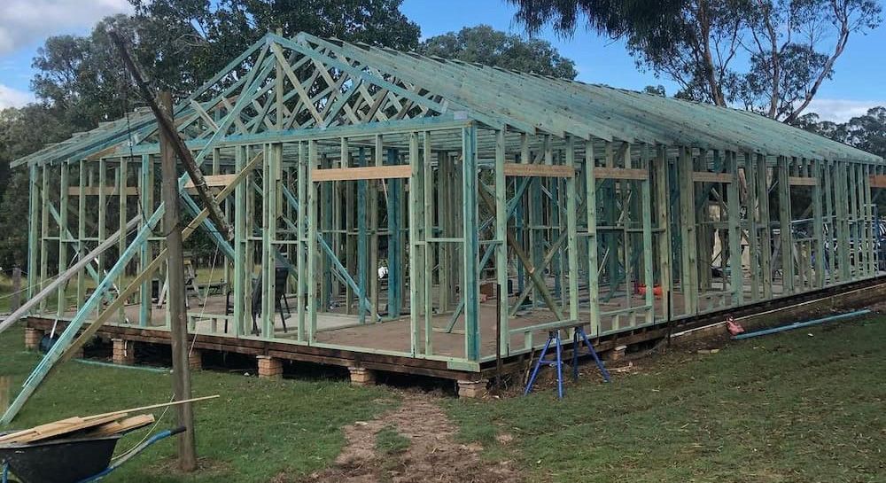A Large House is Being Built in the Middle of a Grassy Field — East Maitland Building In Cessnock, NSW