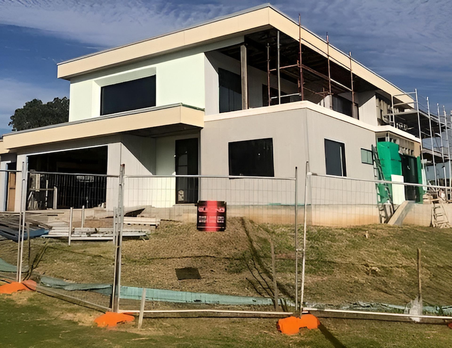 A House Under Construction With a Fence Around It — East Maitland Building In Branxton, NSW