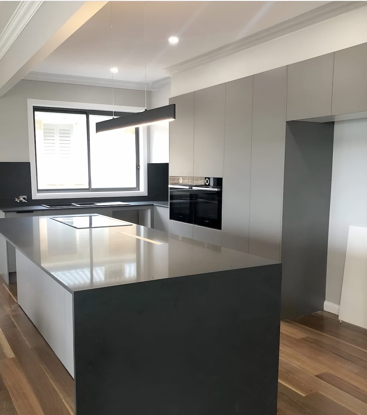 A Kitchen With a Large Island in the Middle — East Maitland Building In Tenambit, NSW