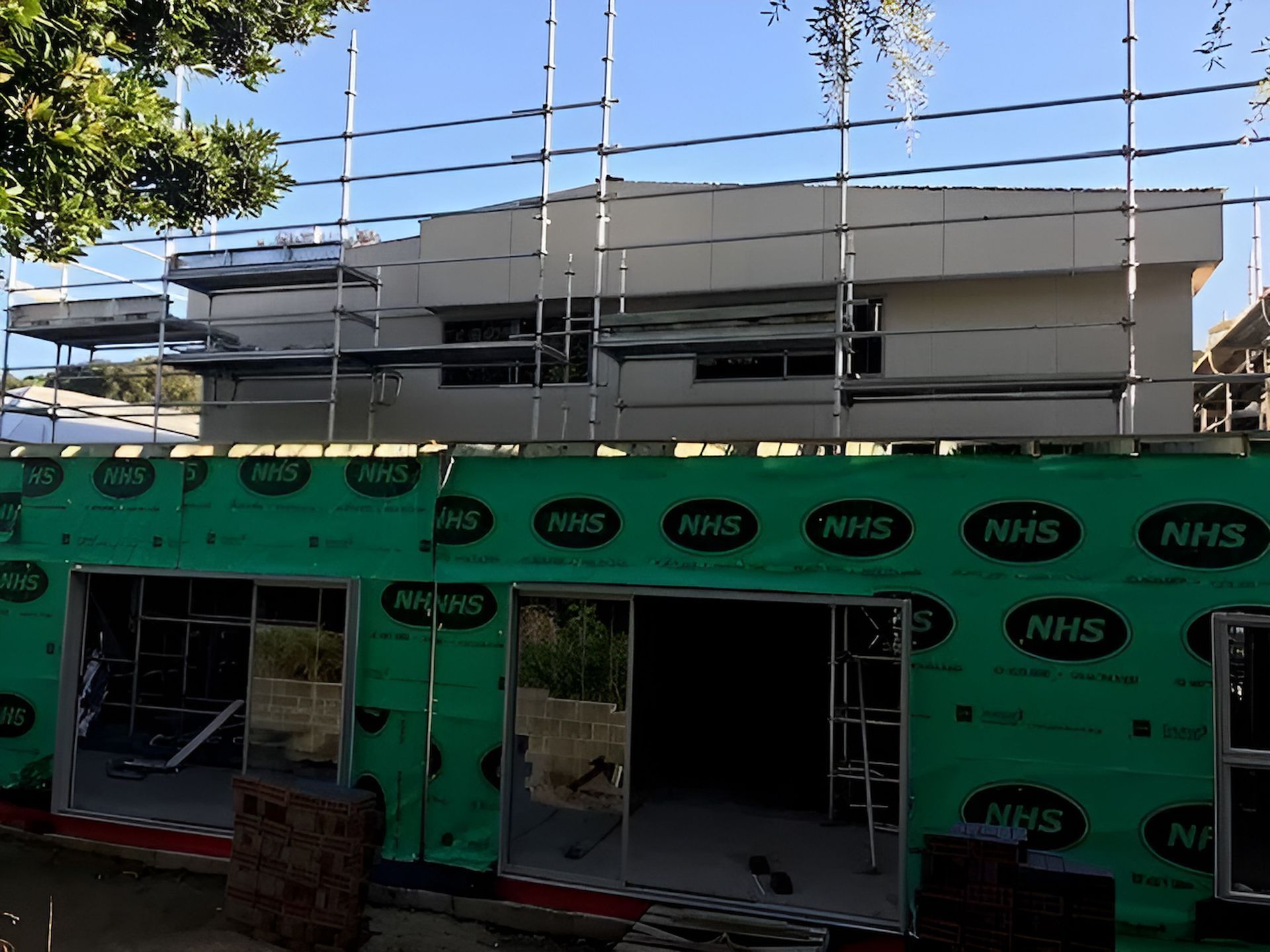 A Large Building is Being Built With Scaffolding Around It — East Maitland Building In Maitland, NSW