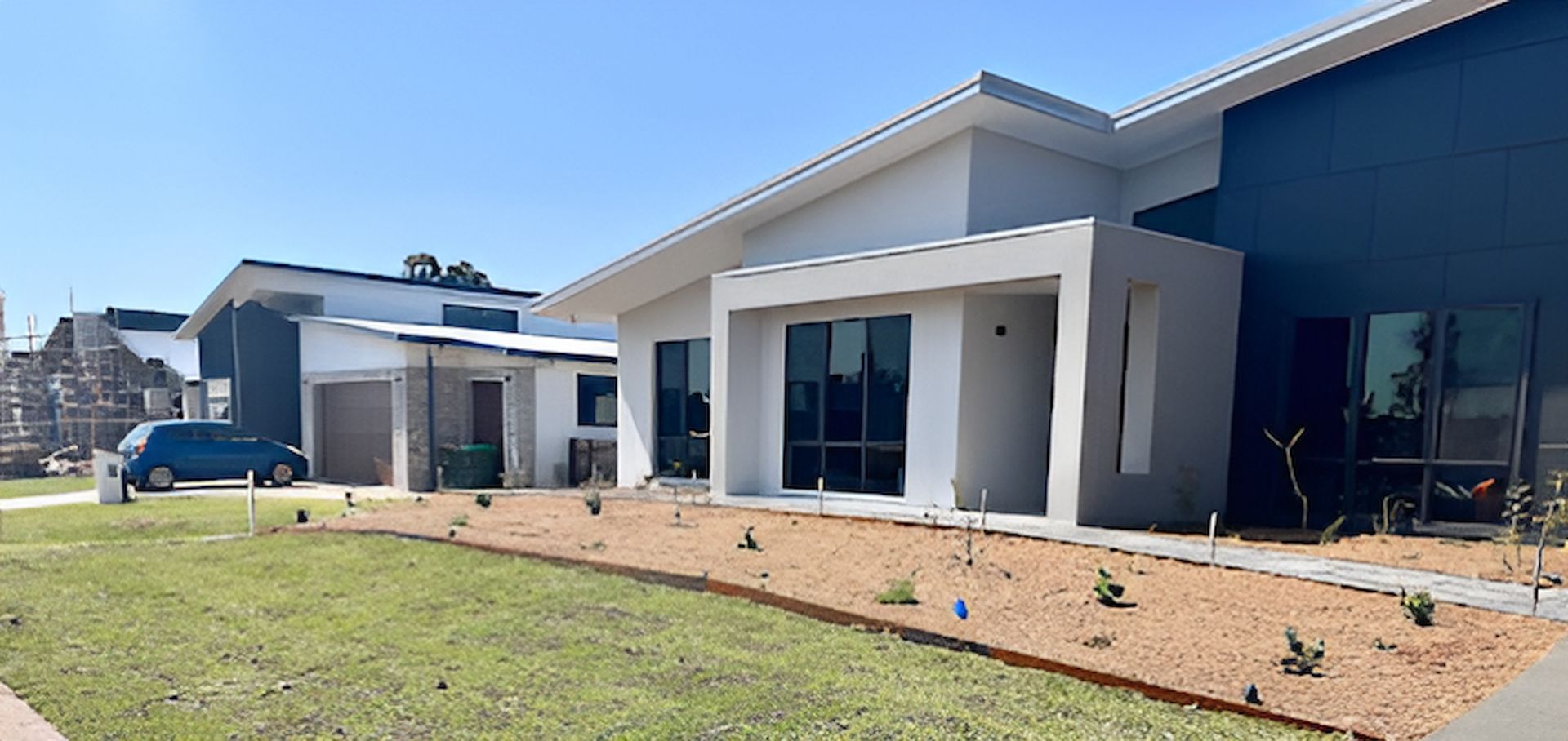 A Row of Houses Are Sitting Next to Each Other in a Residential Area — East Maitland Building In Port Stephens, NSW