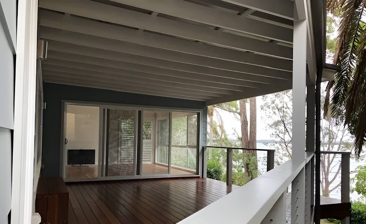An Empty Deck With a View of a Body of Water — East Maitland Building In Branxton, NSW
