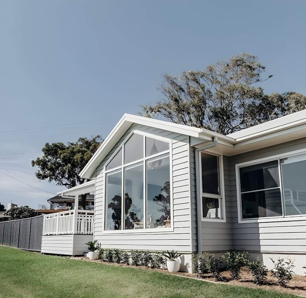 A Large White House With a Lot of Windows — East Maitland Building In Tenambit, NSW