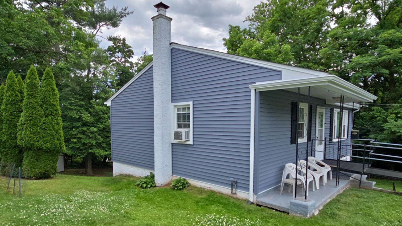Photo of house with new siding after replacement.