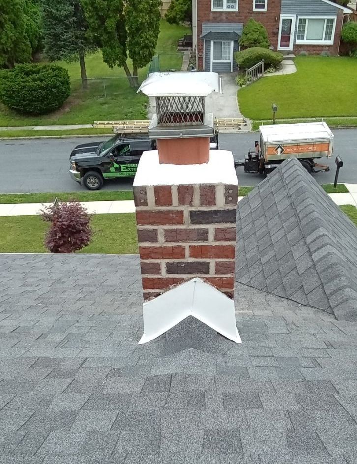 Phot of chimney on the roof of a house after repair.