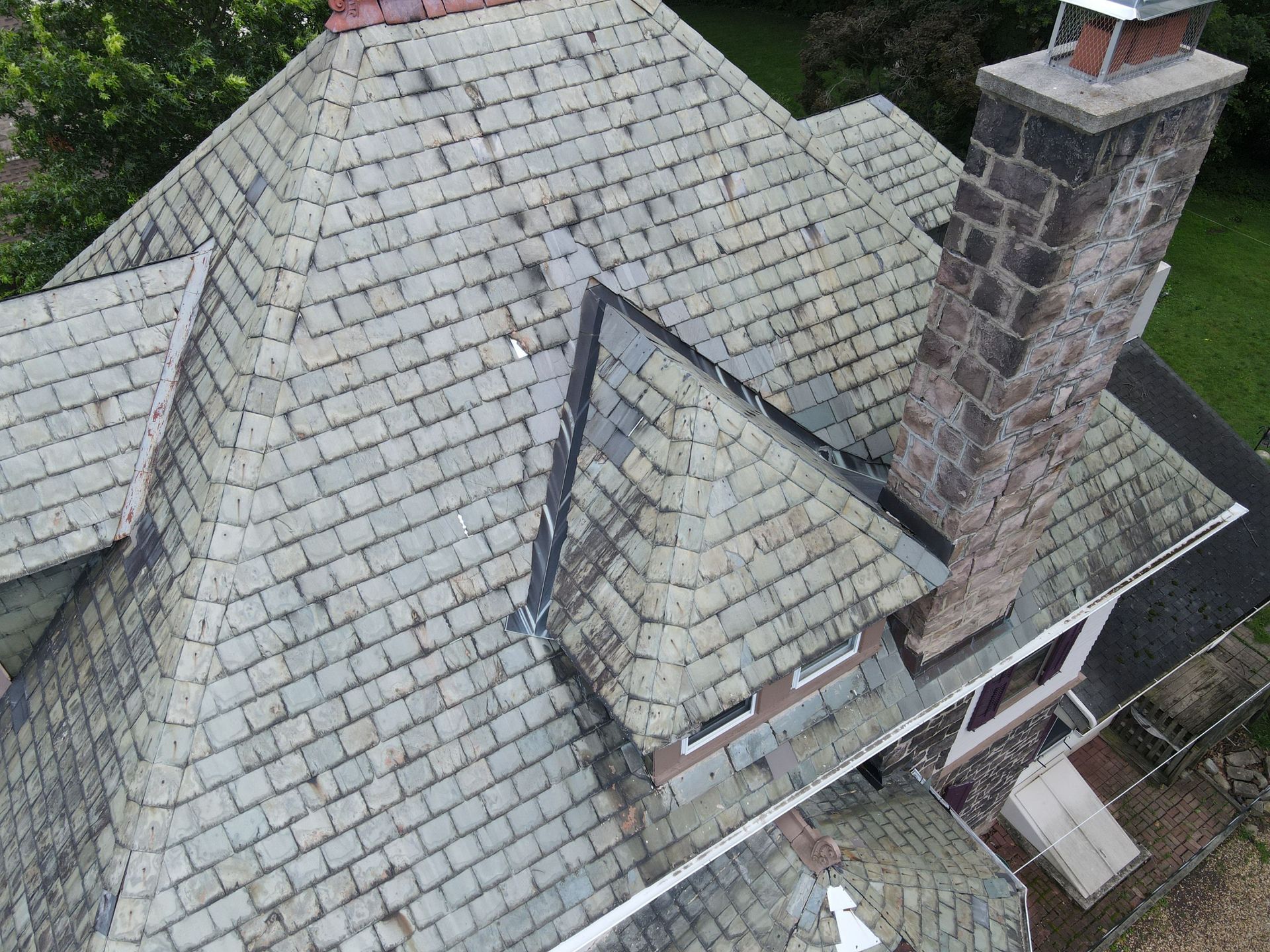 Aerial photo of house before roof replacement