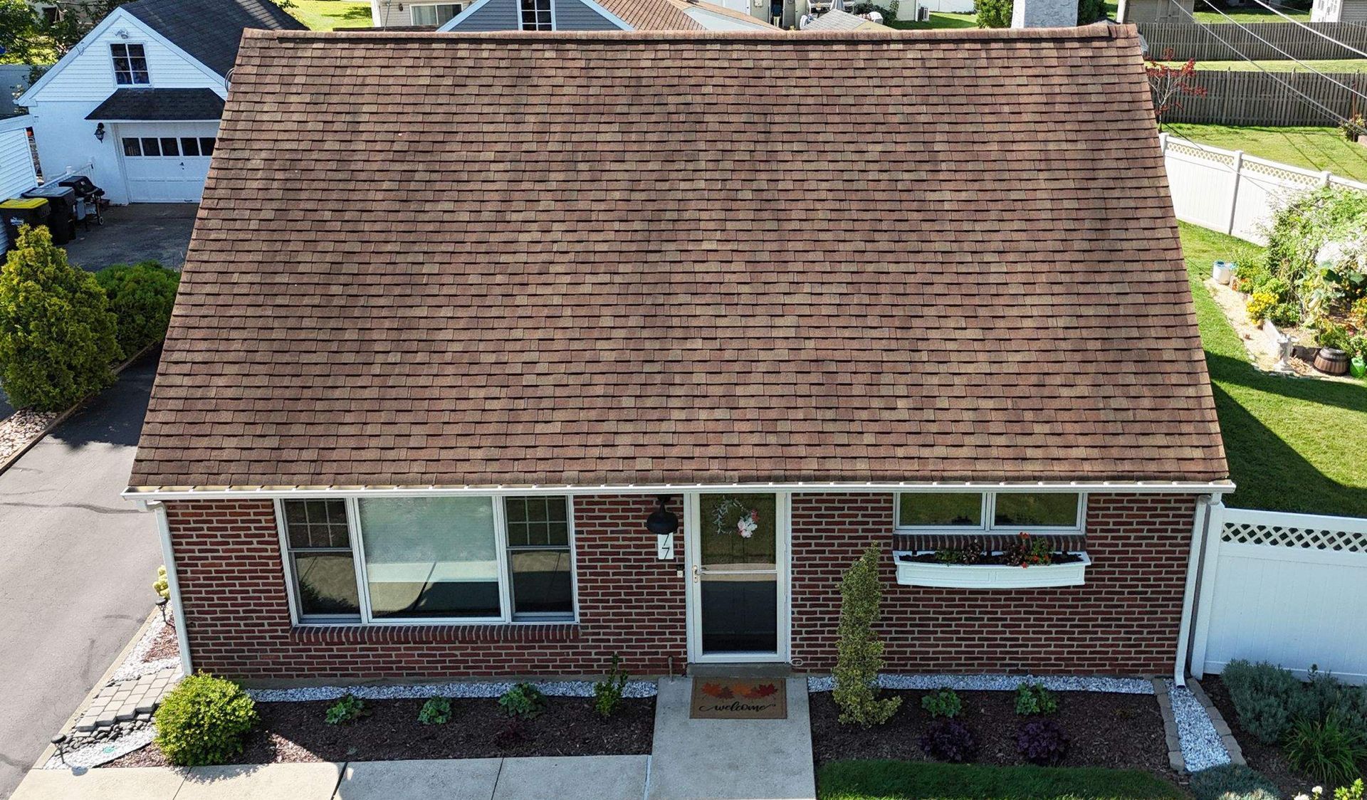 Photo of a roof of a house in need of repair.