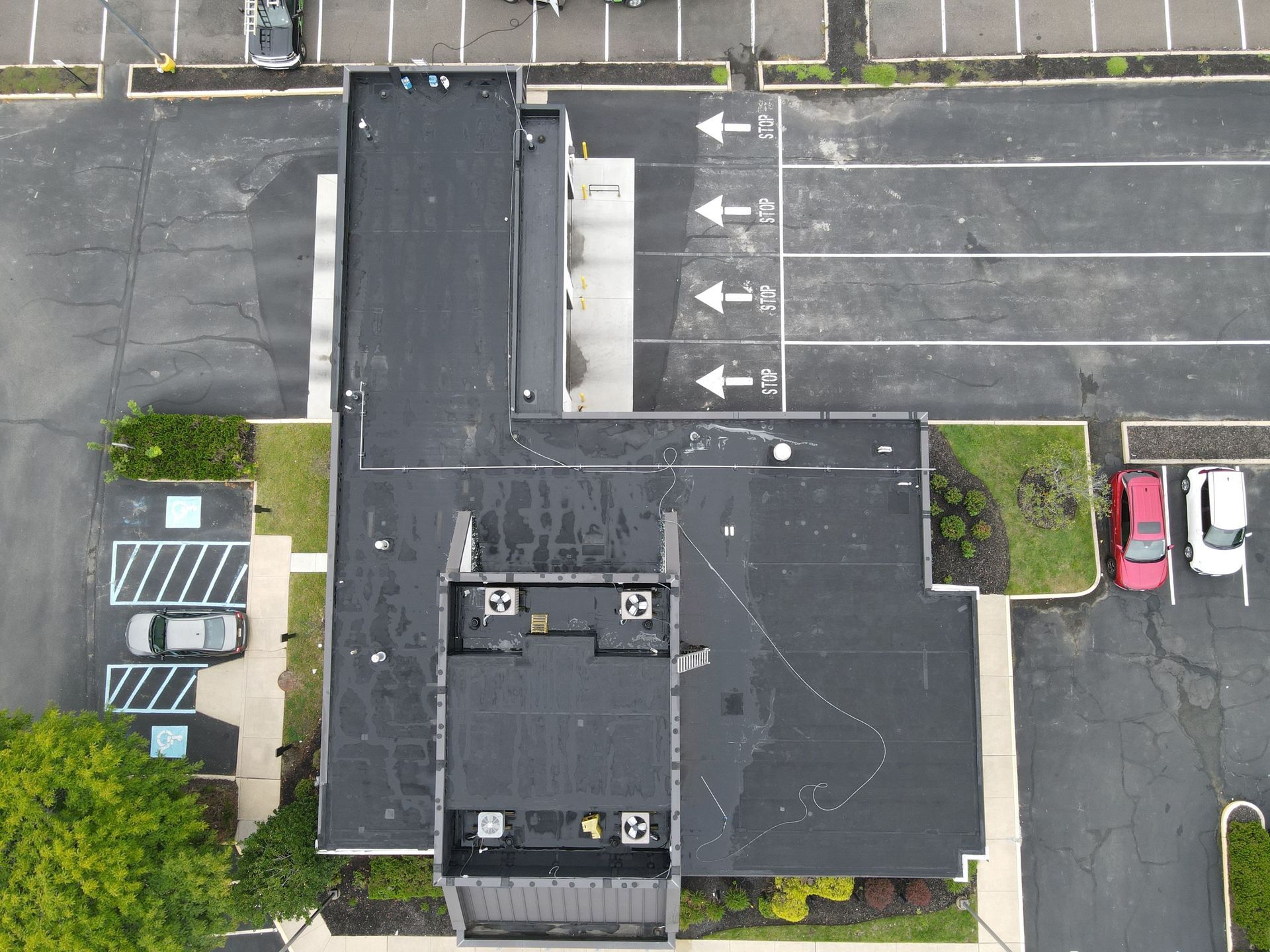 Photo of commercial building before roof replacement.