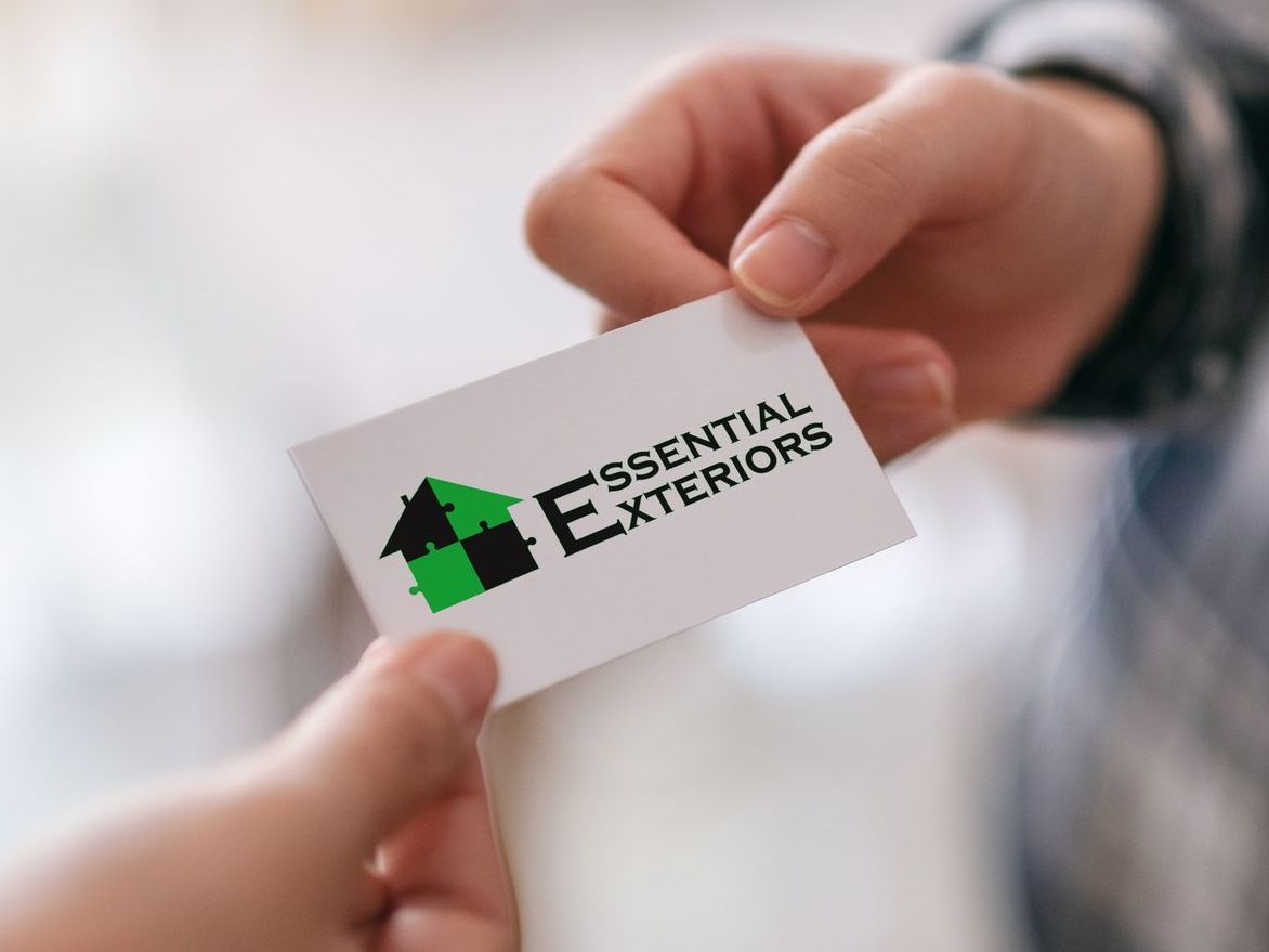 Customer handing an Essential Exteriors business card to a neighbor
