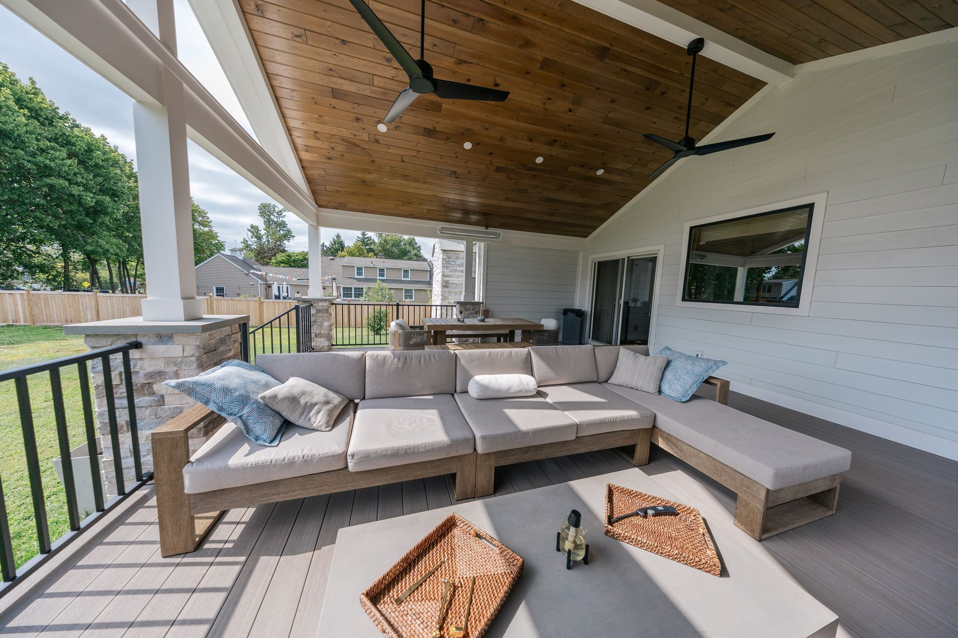A photo of a beautiful new deck attached to a home. 