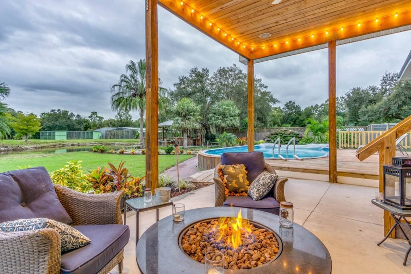 There is a fire pit in the middle of the patio.