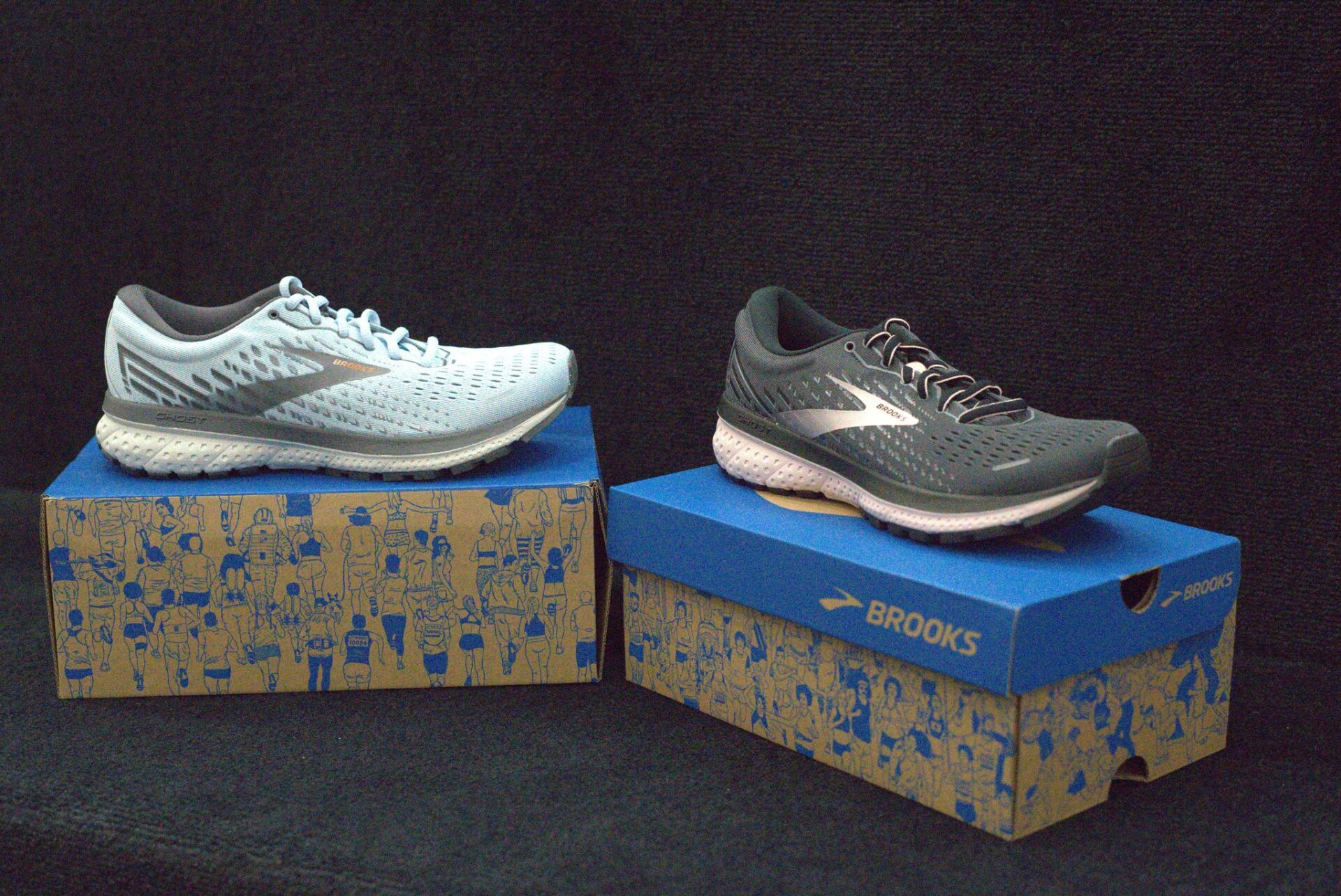 A pair of brooks shoes sitting on top of a box