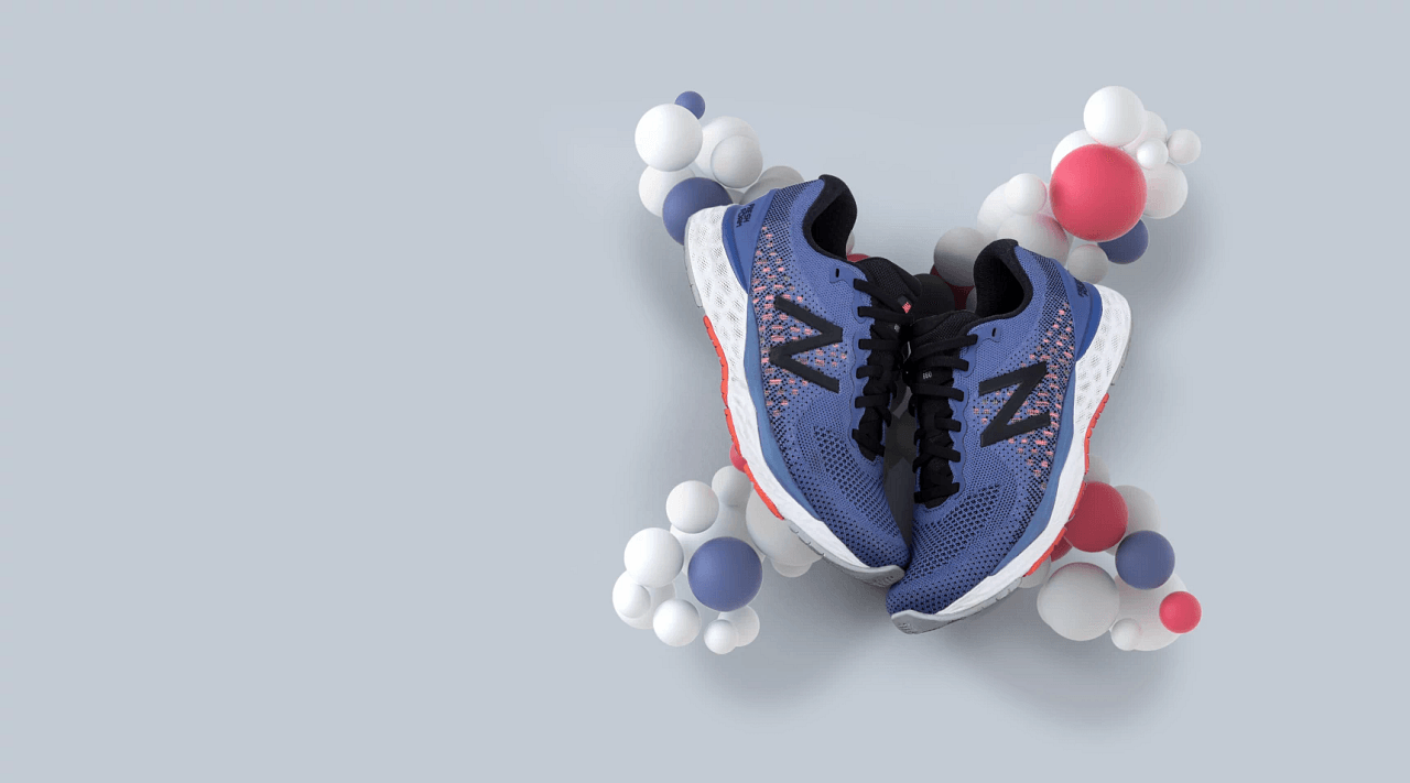 A pair of blue and red new balance shoes are surrounded by balloons.