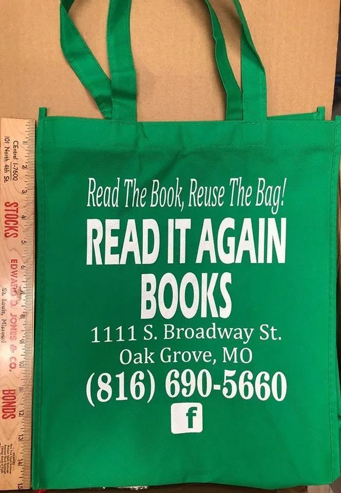 Green tote bag with white text promoting