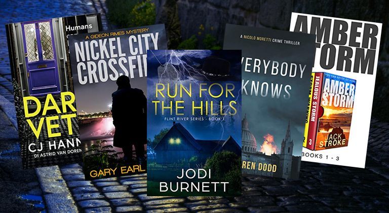Stack of thriller novels with dark covers and large title text, including Dark Vetti, Nickel City Crossfire, and Amber Storm.