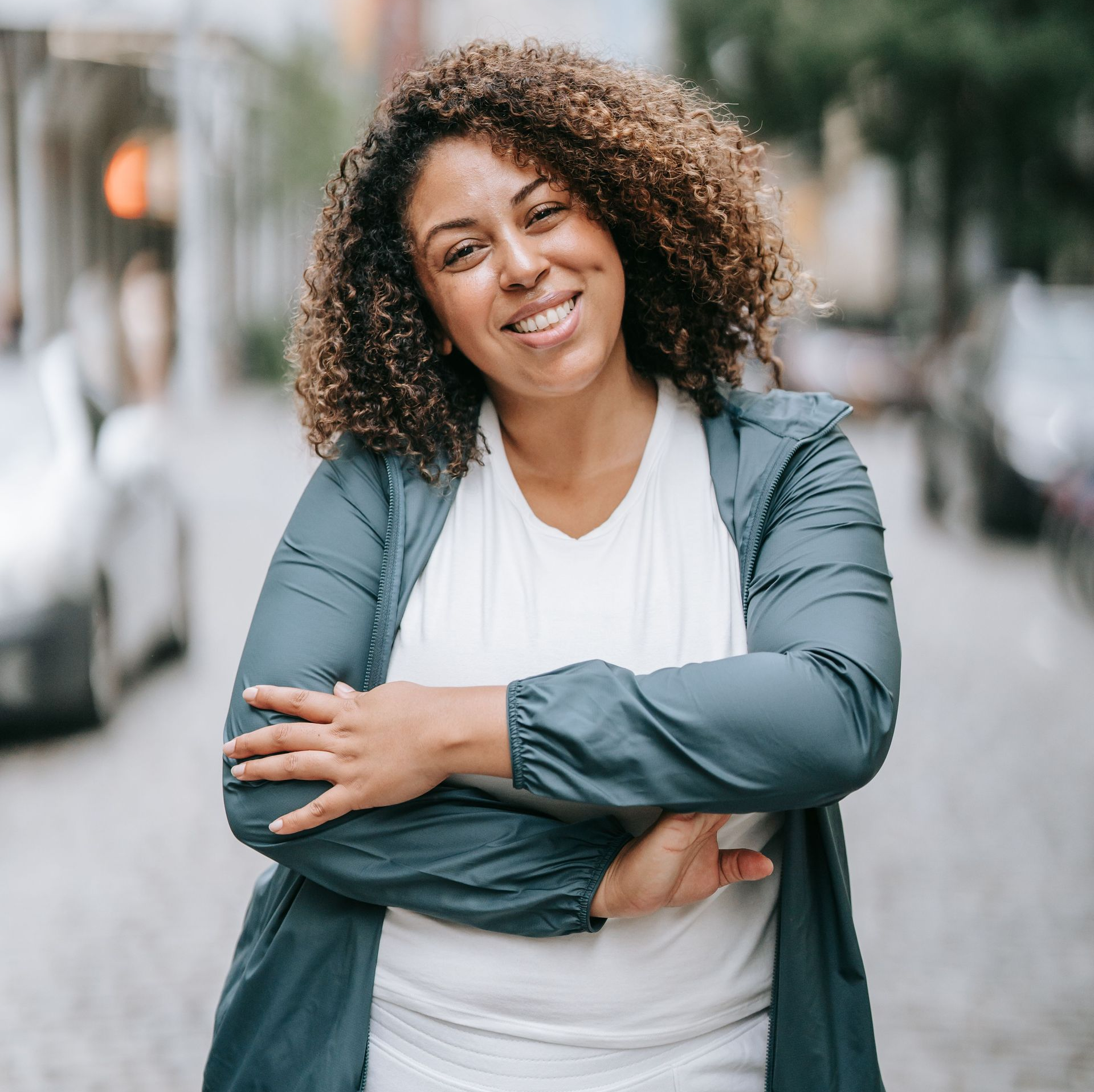 African American female smiling wearing a green jacket - About Us at Greenville Women's Clinic in South Carolina offering abortion care.