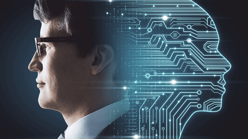 Man in glasses faces a glowing digital circuit profile on a dark background