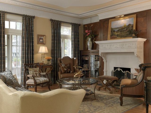 A living room filled with furniture and a fireplace