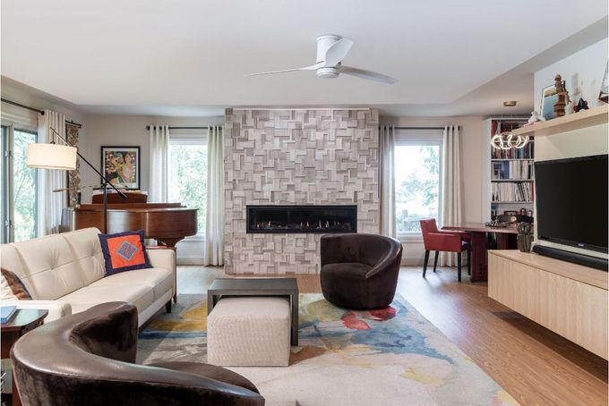 A living room filled with furniture and a fireplace.