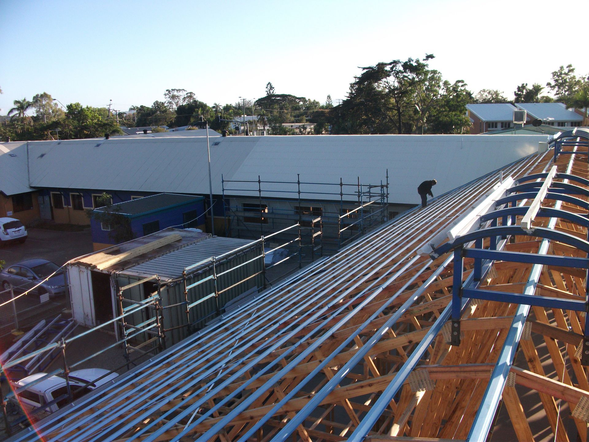 Blue Metal Roof Framing Under Construction With Forest Background — Roof 4 U in Alice River, QLD