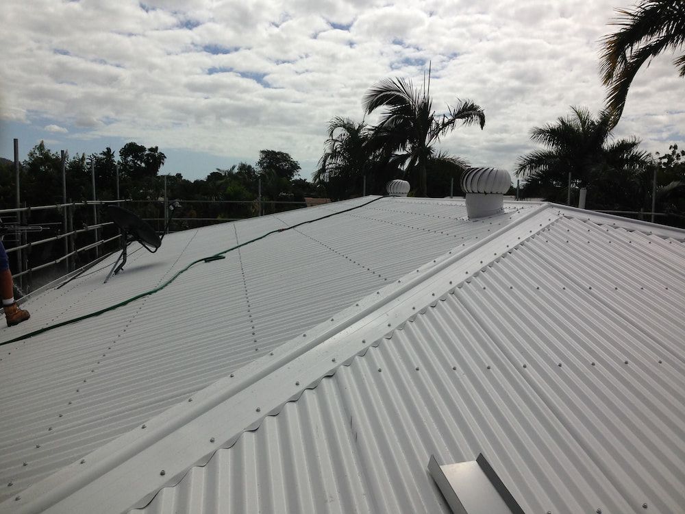 White Metal Roof With a Cloudy Sky Background — Roof 4 U in Alice River, QLD