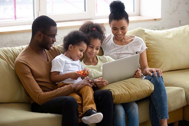 A family choosing an urn or keepsake for their loved ones remains.