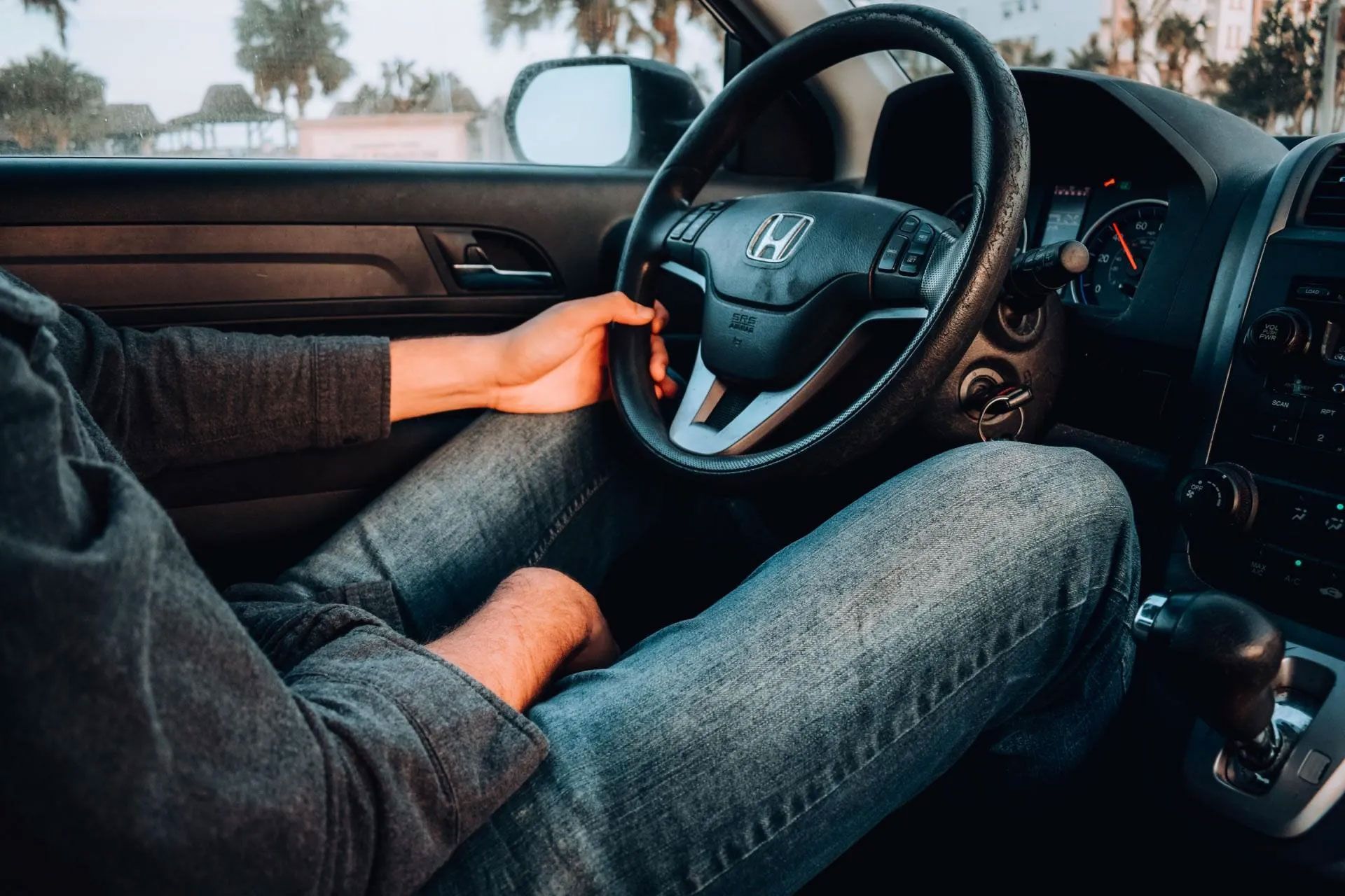 Man Driving in Vehicle Covered by Auto Insurance